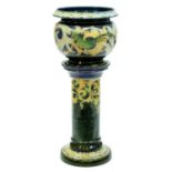 A Doulton ware  Art Nouveau jardiniere and pedestal, designed by Mark V Marshall, c1904-07, slip