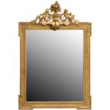 A sanded giltwood and composition mirror,  the rectangular frame with ribbon and reed surround and