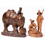 A South East Asian carved wood sculpture of an elephant with mahout, early 20th c,  20ct h and a
