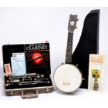 A Keech ukelele,  cased and a Buescher clarinet, cased Good condition