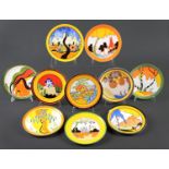 Clarice Cliff. Nine Wedgwood bone china and one earthenware "Bizarre" wall plates, 1990's, various