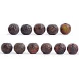 Eleven Chinese brown jade carved beads,  approx 25mm diam, Good condition