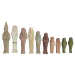 Antiquities. An ancient Egyptian turquoise faience ushabti, 10cm long, nine others, ancient and