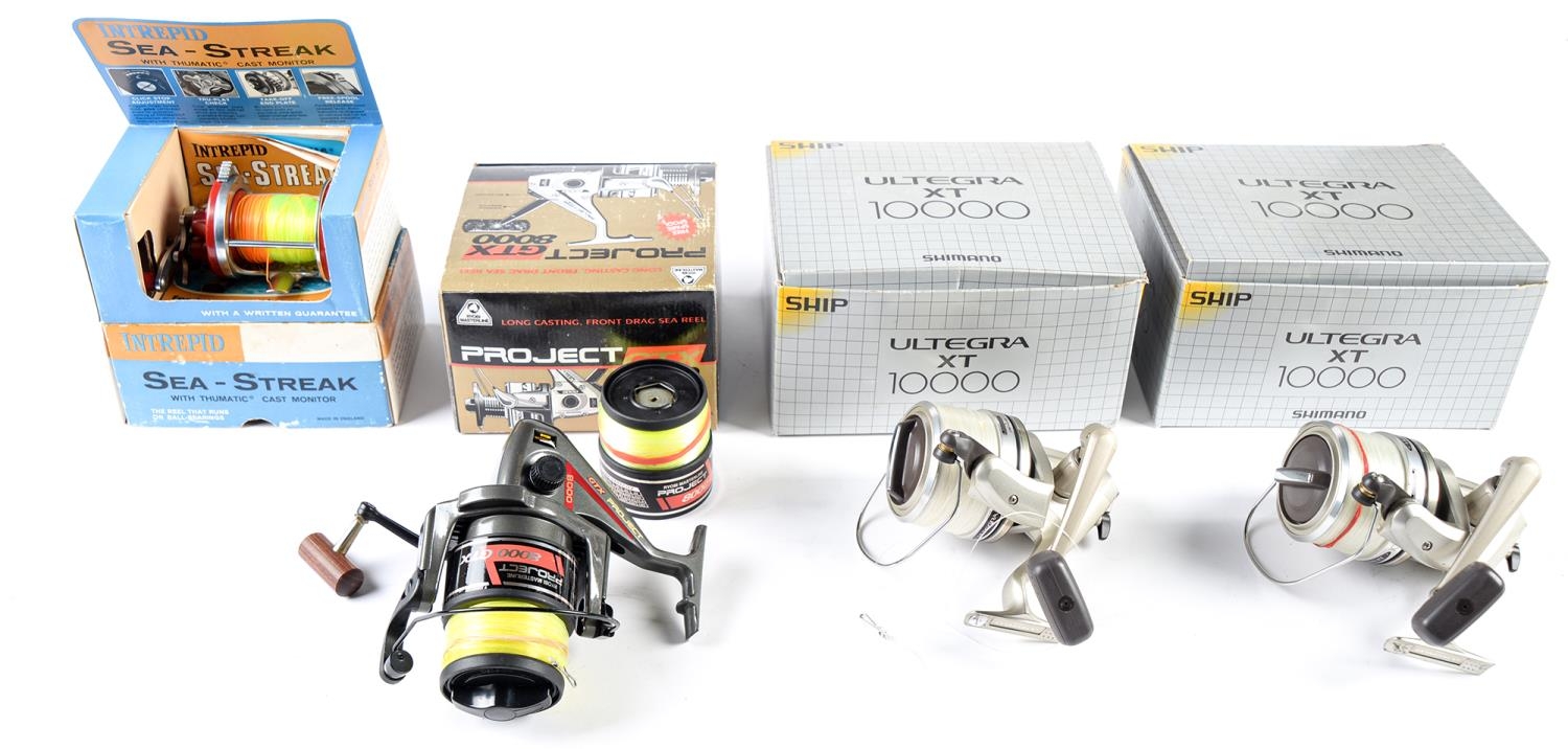 Sea fishing. A pair of Shimano Ship Ultegra XT 10000 reels, both with cloth pouch, maker's zip