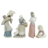 Four Lladro figures of children and young women, 26cm h and smaller, printed mark Good condition