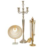 An antique style polished metal five light standard candelabrum and brass companion stand and