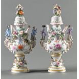 A pair of Meissen floral encrusted vases and covers, late 19th c, with diminutive figure handles