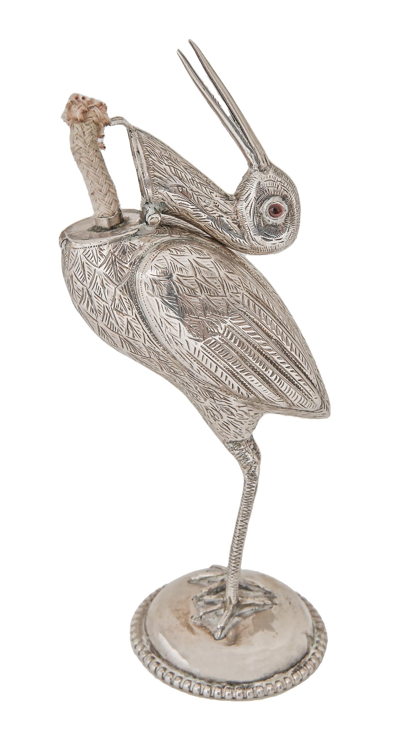 A Continental stork novelty lighter, with red glass bead eyes, the head forming the cover, on - Image 2 of 2