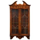 A mahogany hanging cabinet, with swan neck pediment, 106cm h; 20 x 61cm Good condition