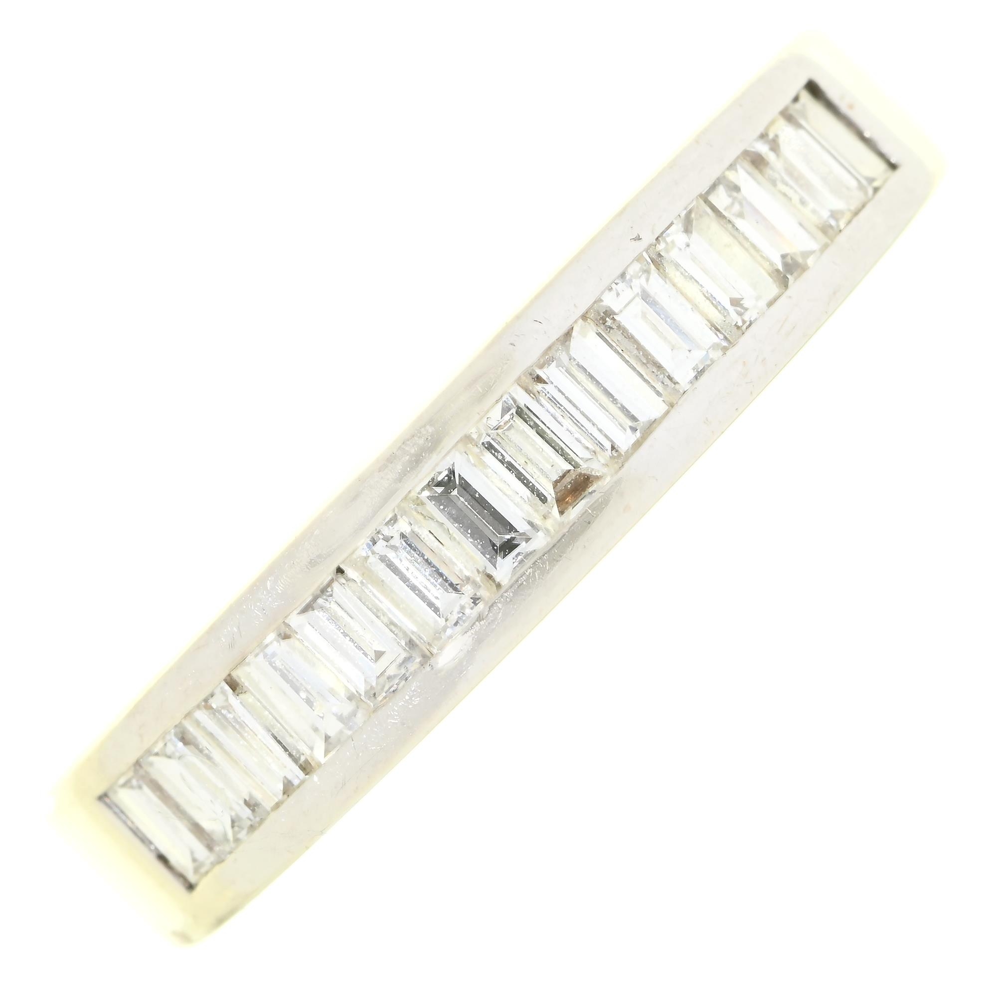 A diamond ring, with nine baguette cut diamonds, in white gold marked 750, 5g, size L½ Good