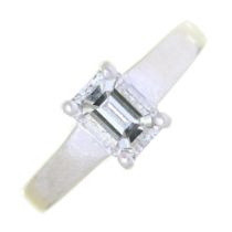 A diamond solitaire ring, with emerald cut diamond of approximately 5.7mm, in platinum, 9.3g, size J