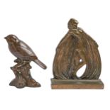 A bronze semi-naked dancer figural bookend and a bronze sculpture of a finch on a stump, 20th c,