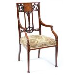 An Edwardian mahogany and inlaid armchair,  with carved and pierced splat to the curved back,