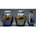 A pair of S Fielding & Co Lustrine ginger jars and covers and a vase, C1920-30, decorated with