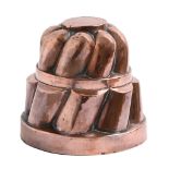 A Victorian copper jelly mould, c1900, 15cm h Minor dents and wear with some polish residue, not