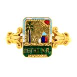 A gold and enamel spinning ring, early 20th c, one side of the tablet inscribed Sethi M.R., the