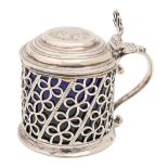 A George III pierced silver mustard pot, with pierced thumbpiece, crested, blue glass liner, 80mm h,