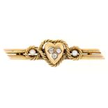 A diamond bar brooch, c1900, in gold and of heart and rope design, 43mm l, marked 15ct, 3.7g Good