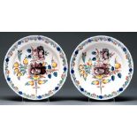 A pair of Dutch Delft ware dishes, 19th c, decorated in polychrome with stylised flowers in trailing