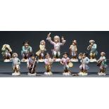 A Volkstedt monkey band, late 19th c, after the Meissen originals, conductor 14cm h, impressed