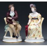 A pair of German porcelain figures of a lady and gentleman seated on yellow chairs, late 19th c,