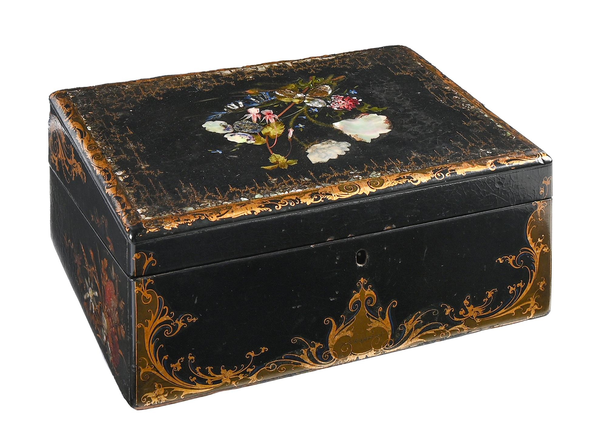 A Victorian papier mache writing box, with fitted interior, decorated with flowers and gilt, 31cm l