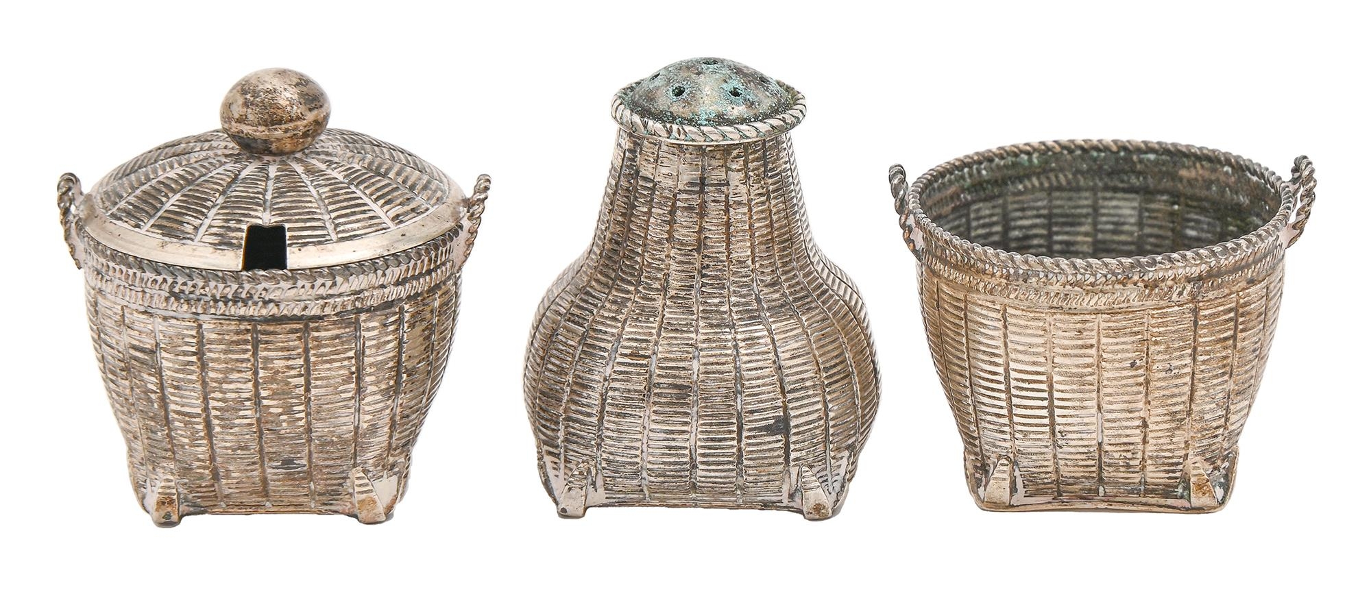 A Chinese silver three piece basket form condiment set, early 20th c, pepperette 40mm h, maker L.Y.