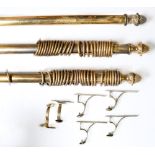 A set of three brass curtain poles, 50mm diam and 191, 336 and 420cm (210+210) l, four cast brass