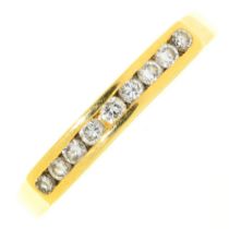A nine stone diamond ring, channel set in 18ct gold, marks obscured, 2.8g, size N½ Light wear