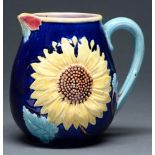 A majolica sunflower jug, late 19th c, the interior in pink glaze 13.5cm h Tiny graze on tip of lip