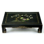 A South East Asian lacquer low table, the top decorated with a bird and prunus blossom, 30cm h; 76 x