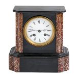 A marble and noir belge mantel clock, late 19th c, with bell striking movement, pendulum, 22cm h