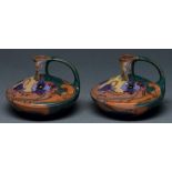 A pair of Gouda art pottery ewers, c1900, painted with sweetpeas, 95mm h, impressed 337, painted
