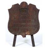 HMS "Dwarf ".  A shield shaped board of wood, presumably from the vessel, carved with naval crown