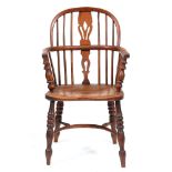 A Victorian yew wood and ash low back Windsor chair, East Midlands region, with crinoline