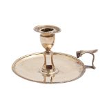 A George III silver chamberstick, with vase shaped sconce and nozzle, beaded rims, 13.5cm diam, by