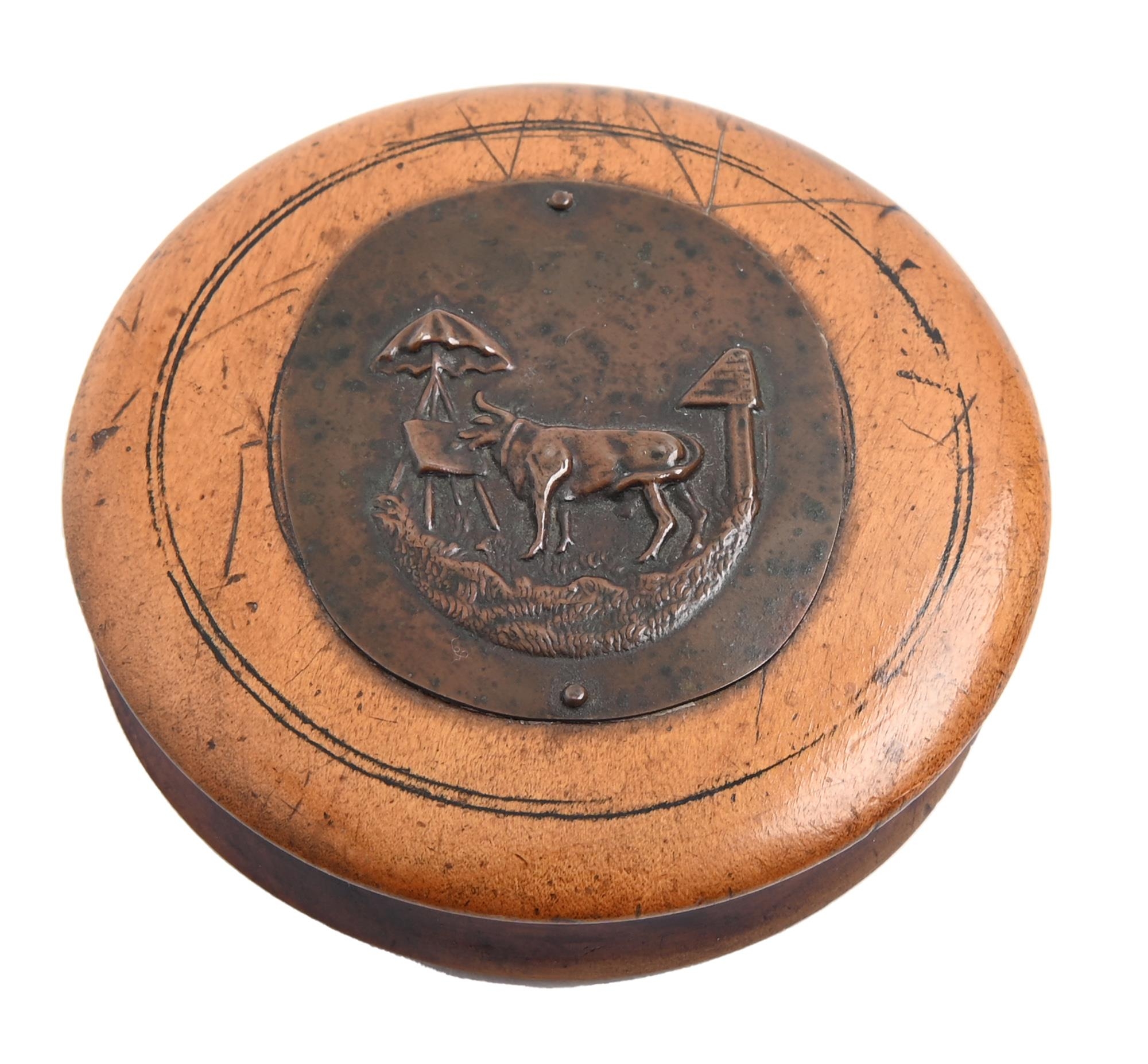 A Victorian turned sycamore snuff box and cover,  applied with a copper medallion stamped with a cow