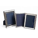 Three Elizabeth II silver photograph frames, 23.5 x 18.5cm and smaller, by Carrs of Sheffield Ltd,