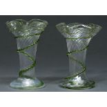 A pair of Edwardian clear and green trailed spirally fluted glass vases, 23cm h Good condition