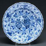 A Dutch Delftware dish, 18th c,  painted in cobalt with a stylised bird flanked by peonies, in