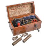 A Victorian mahogany therapeutic magneto-electric machine,  printed label to underside of the lid,