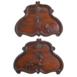 A pair of Victorian carved walnut cartouches,  with leaping deer and applied gilt rosette, 19cm h,