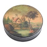 A papier mache snuff box and cover, c1840, the cover painted with a man by a river, 84mm diam