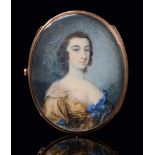 English School, late 18th c - Portrait Miniature of a Lady with curly black hair, in light brown