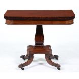 A George IV mahogany tea table, the crossbanded top on baluster pillar and platform, on reeded legs,