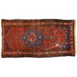 Two antique rugs, 110 x 212cm and 124 x 162cm Localised wear