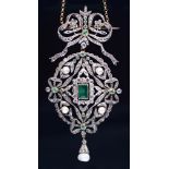 An emerald, diamond and pearl brooch-pendant, early 20th c, of oval framed festoon and bow design