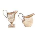 A Victorian silver cream jug, helmet shaped and engraved with ferns, reeded handle and rim, 12cm