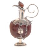 A  silver mounted nut scent bottle, late 19th c, 11cm h including chained stopper Nut cracked,