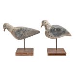 A pair of naïve carved and painted wood models of birds, 20th c, stands 23 and  27cm h Decoration